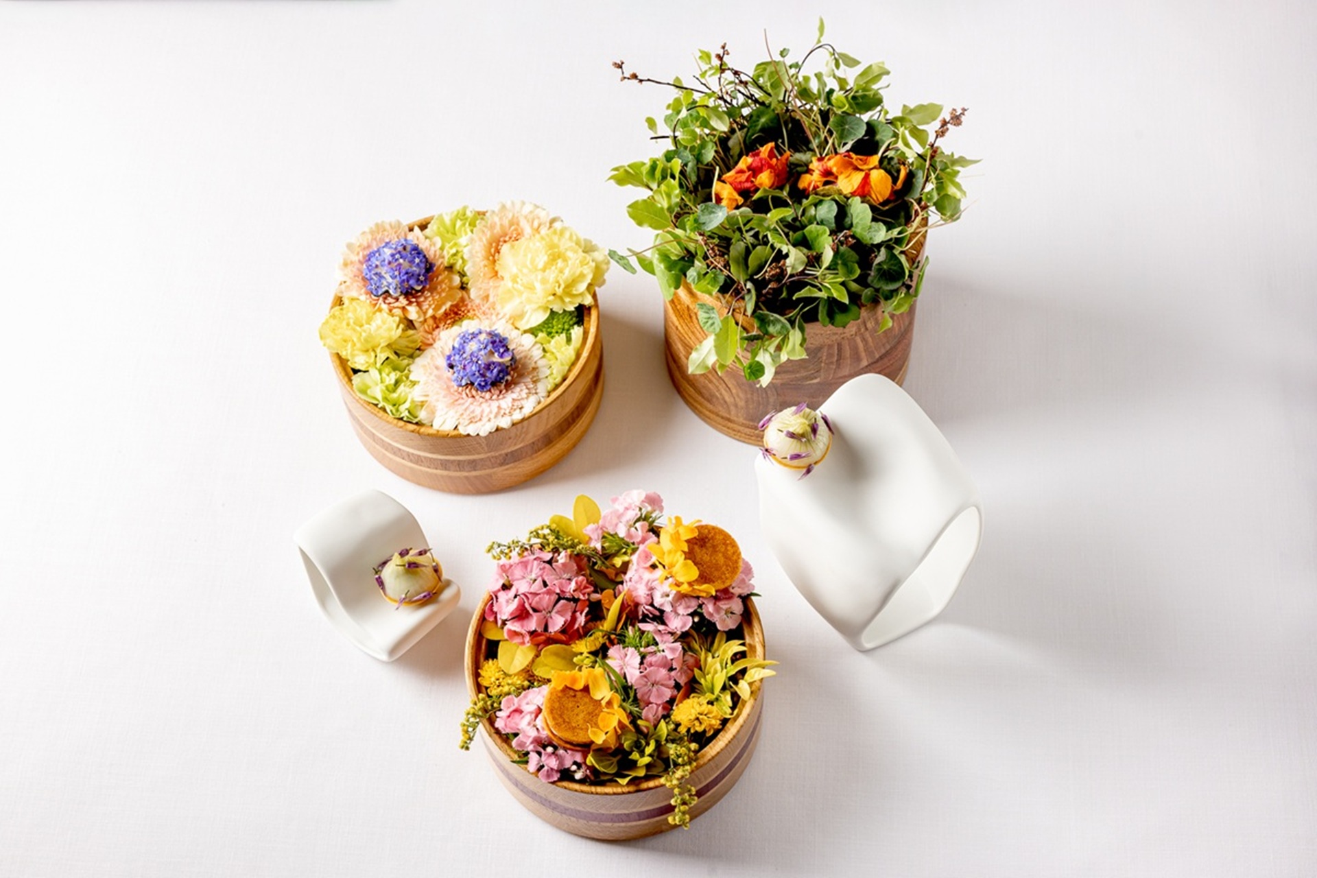 Fine dining dish with vibrant seasonal ingredients, plated elegantly.