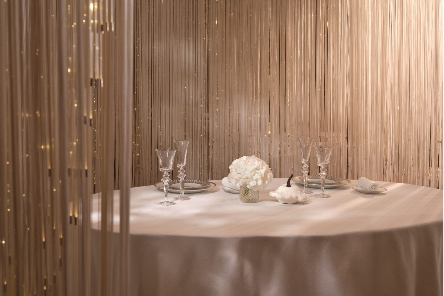 Stunning table setting with crystal backdrop and crisp white table cloth