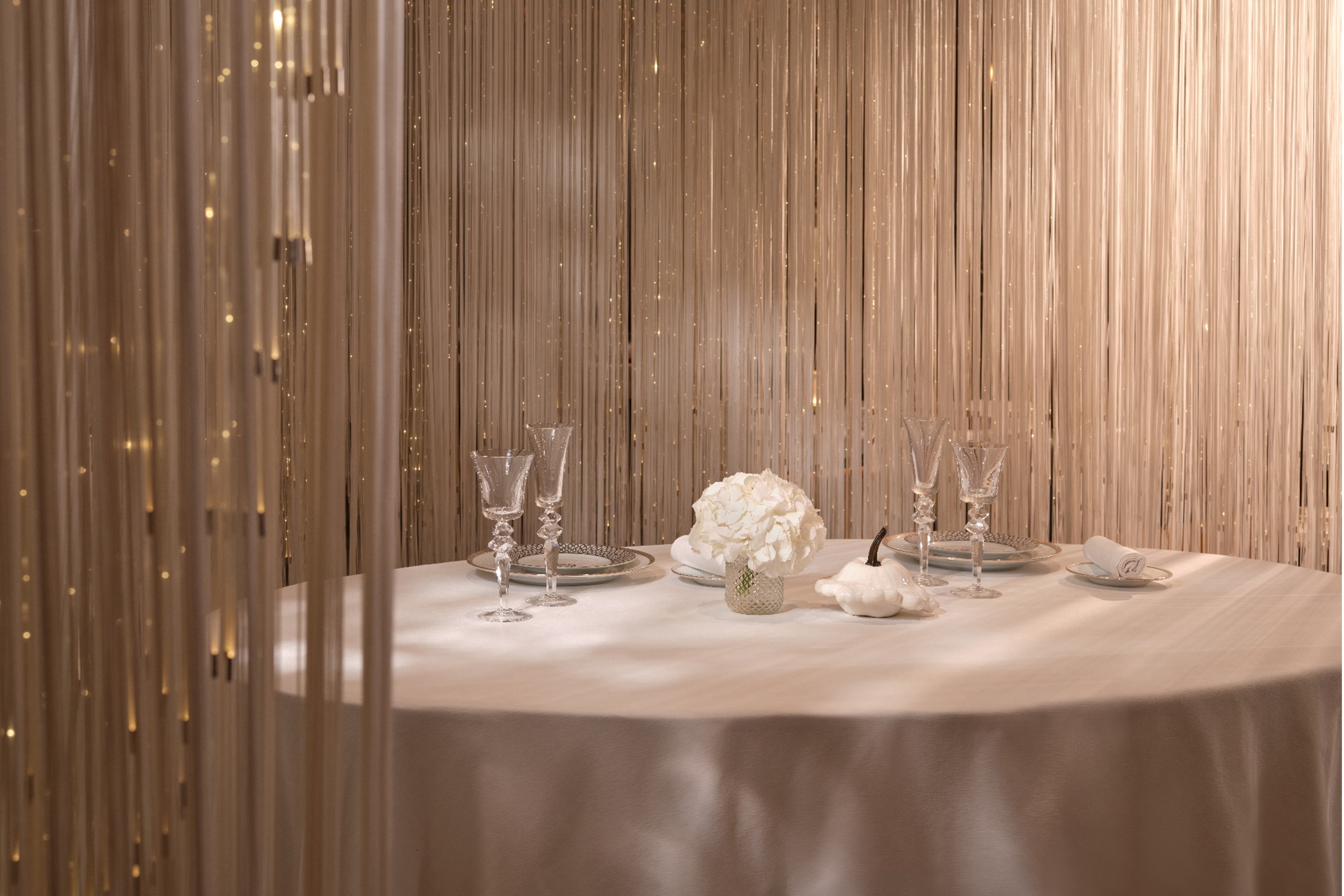 Stunning table setting with crystal backdrop and crisp white table cloth