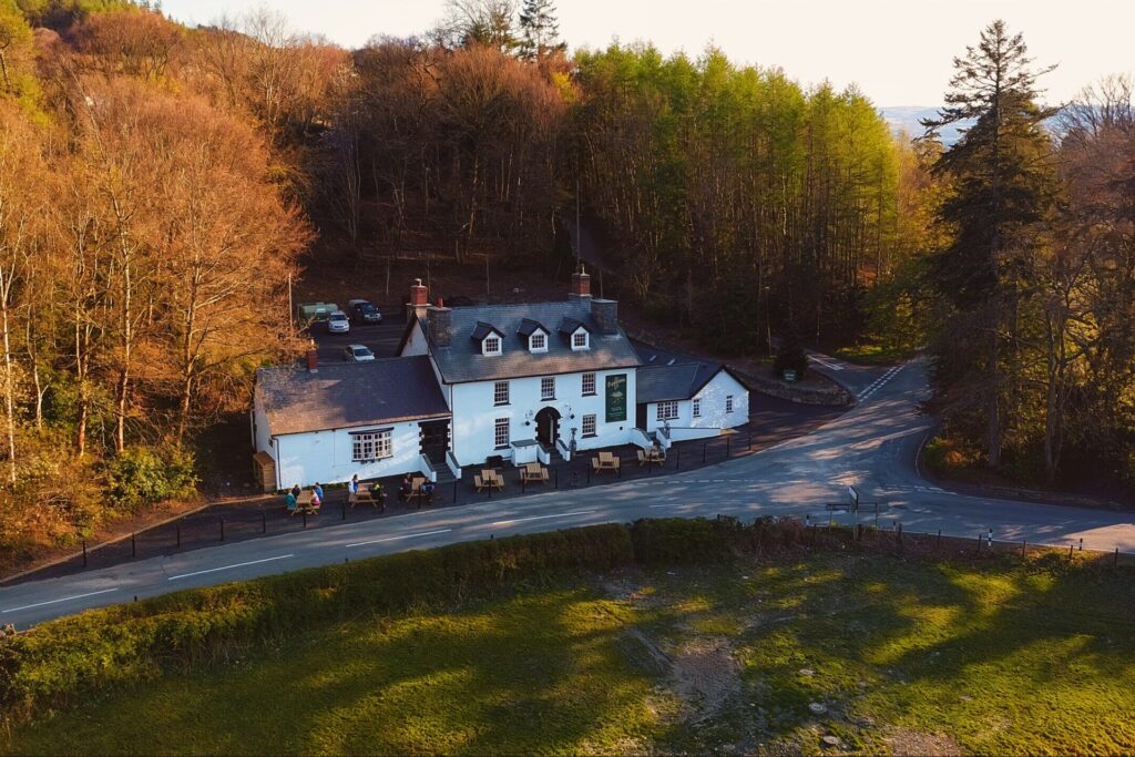 Exterior of The Bryntirion Inn, historic Welsh pub on the Palé Hall estate