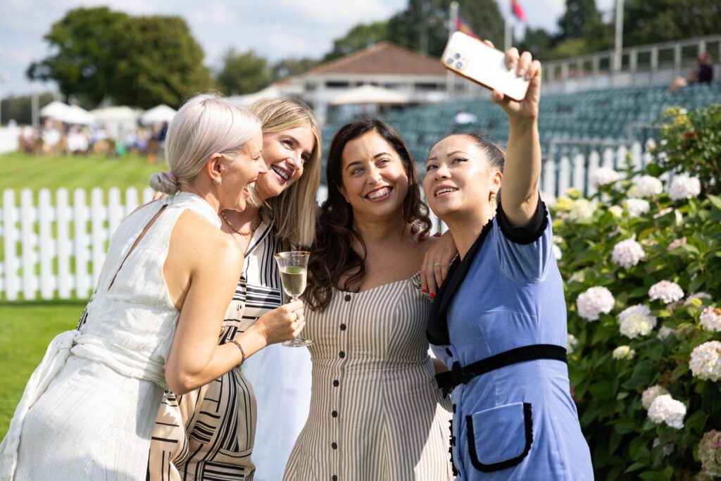 girls instagramming outside Guards Polo Club event